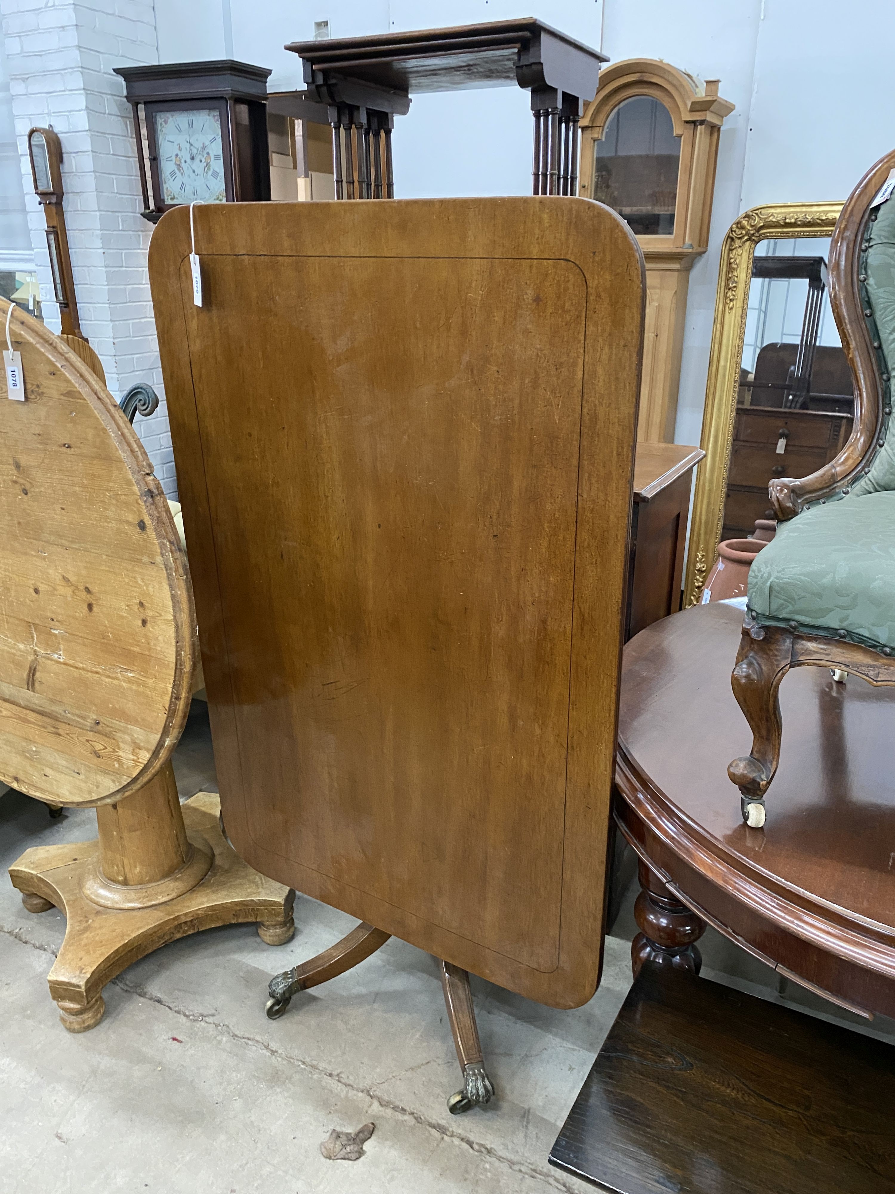 A Regency rectangular mahogany tilt top dining table, length 120cm, depth 79cm, height 72cm